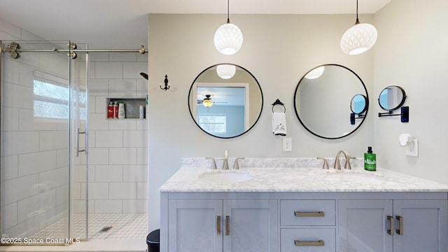 bathroom featuring vanity and a shower with shower door