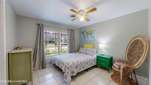 bedroom with light tile patterned flooring and ceiling fan