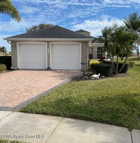 ranch-style home with a front lawn