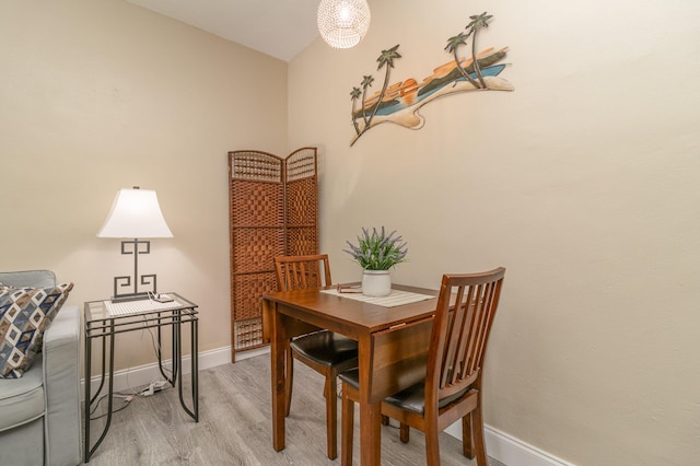 dining area with light hardwood / wood-style floors