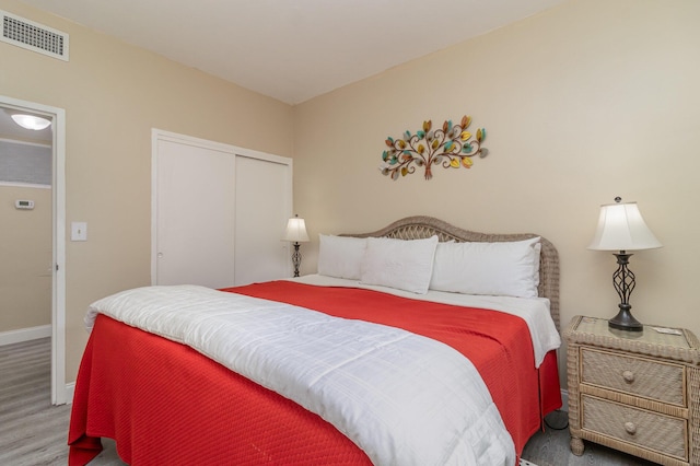 bedroom featuring a closet and hardwood / wood-style floors