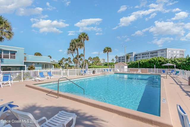 view of swimming pool with a patio