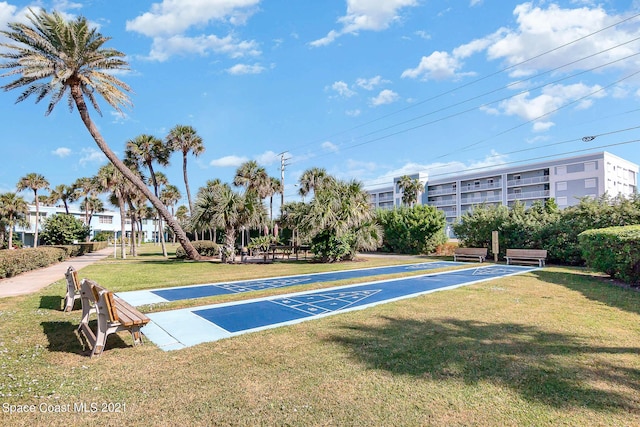 view of home's community featuring a lawn