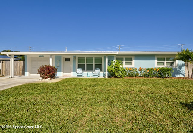 ranch-style home featuring a garage and a front yard