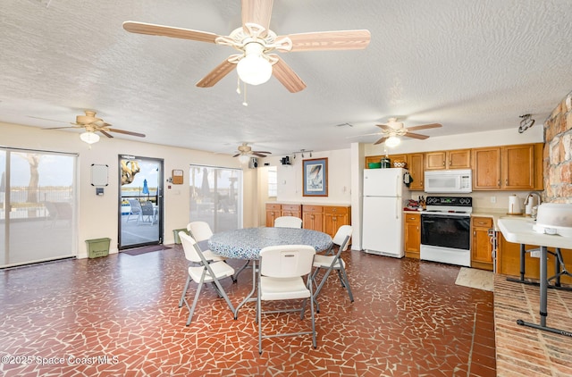 dining space with a textured ceiling