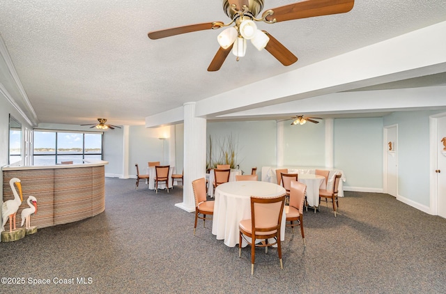 dining area featuring a textured ceiling