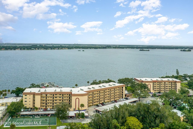 birds eye view of property with a water view