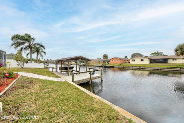 dock area featuring a yard and a water view