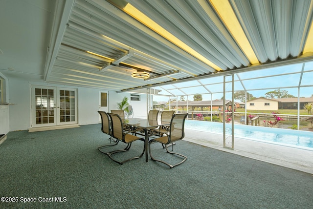 view of patio / terrace featuring glass enclosure and french doors