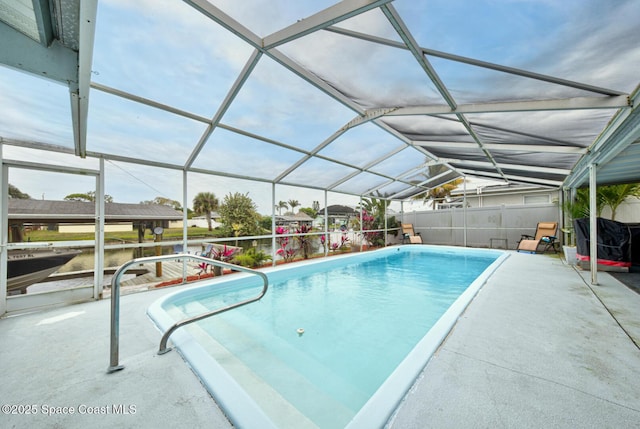 view of pool featuring a lanai and a patio area