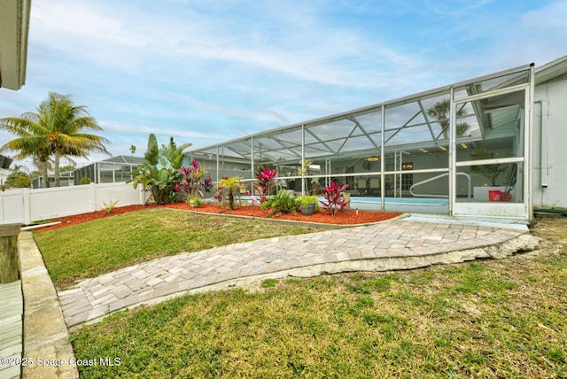 view of yard featuring a lanai