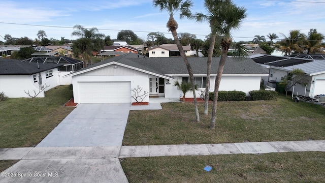 view of front facade with a garage and a front lawn