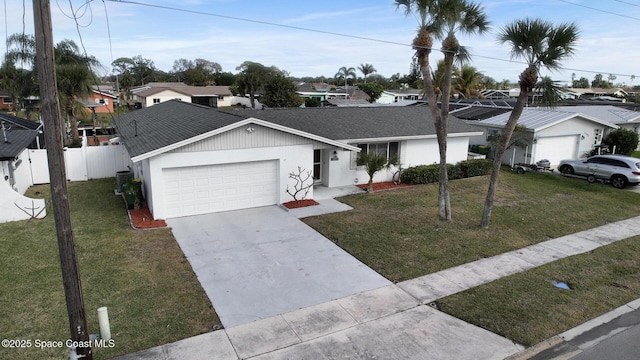 ranch-style home featuring a garage and a front lawn