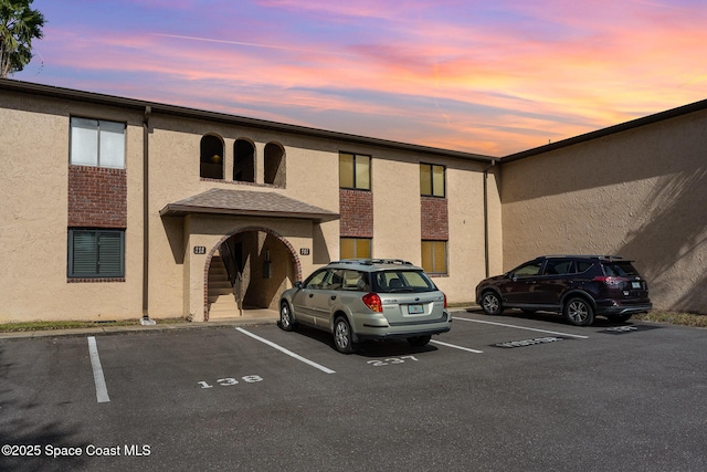 view of outdoor building at dusk