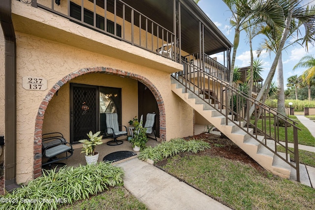 property entrance featuring a patio