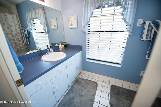 bathroom featuring vanity and tile patterned flooring