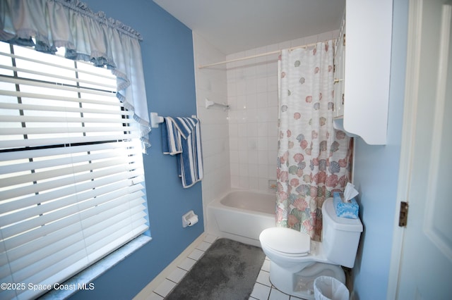 bathroom with toilet, tile patterned flooring, and shower / bathtub combination with curtain