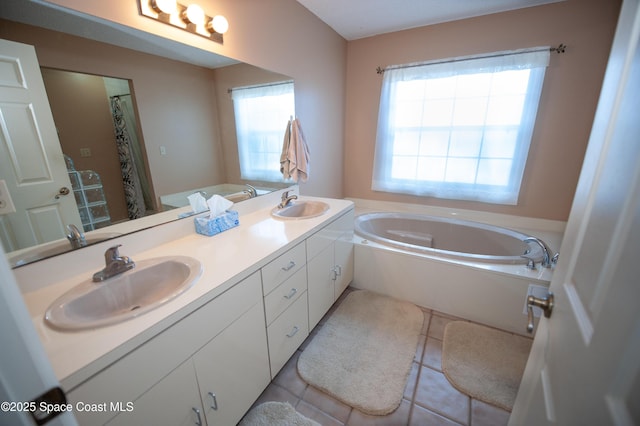 bathroom with shower with separate bathtub, a healthy amount of sunlight, tile patterned floors, and vanity