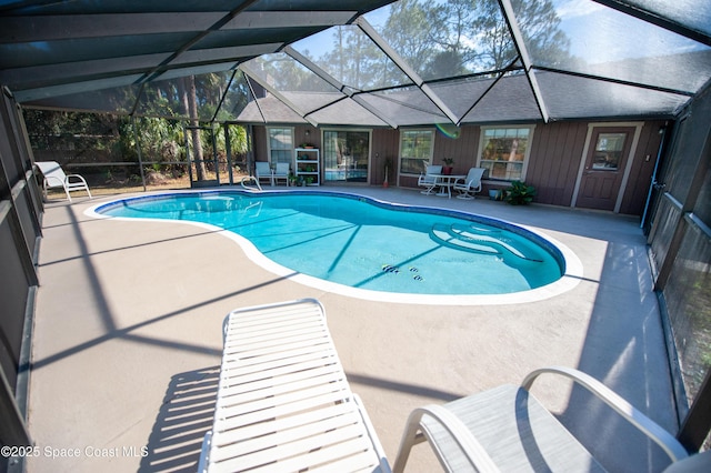 view of pool featuring a lanai and a patio area