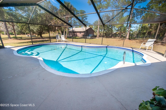 view of swimming pool featuring a patio area, a lanai, and a yard