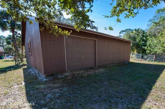 garage with a lawn