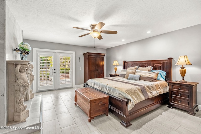 bedroom featuring a textured ceiling, access to exterior, ceiling fan, and french doors