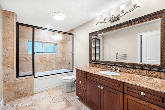 full bathroom with vanity, a textured ceiling, shower / bath combination with glass door, and toilet