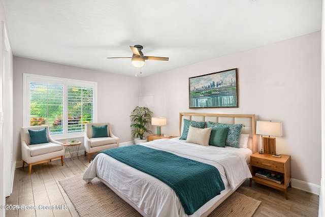 bedroom featuring hardwood / wood-style flooring and ceiling fan