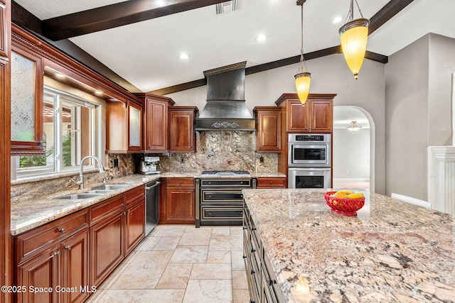 kitchen with premium range hood, appliances with stainless steel finishes, tasteful backsplash, sink, and light stone counters