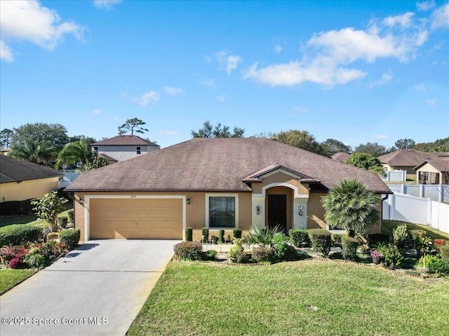 view of front of property featuring a garage and a front yard