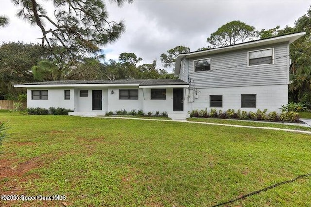 view of front of home with a front lawn