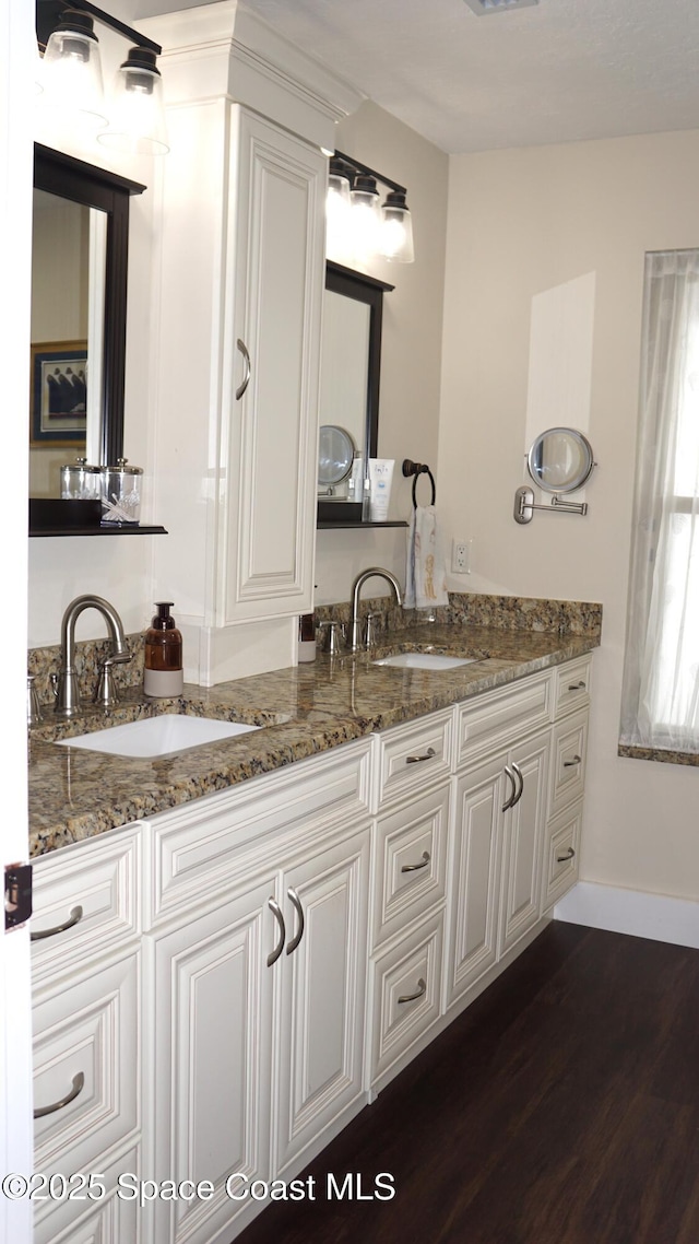 bathroom with hardwood / wood-style flooring and vanity