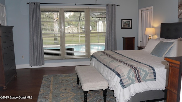 bedroom featuring dark wood-type flooring