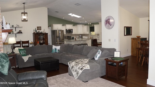 living room with vaulted ceiling and dark wood-type flooring