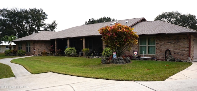 single story home with a front lawn