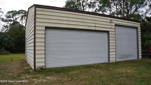 garage with a yard