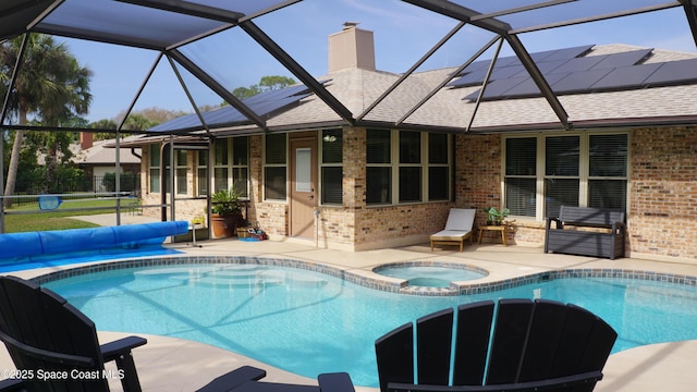 view of pool with a patio and an in ground hot tub