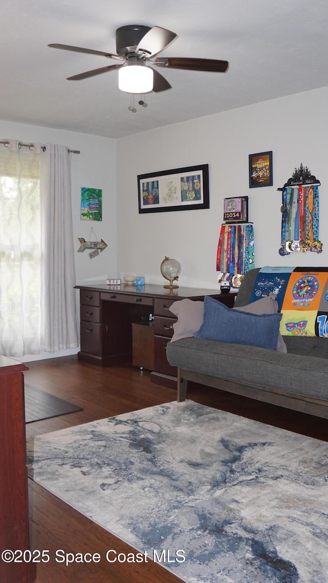 bedroom featuring ceiling fan and dark wood-type flooring