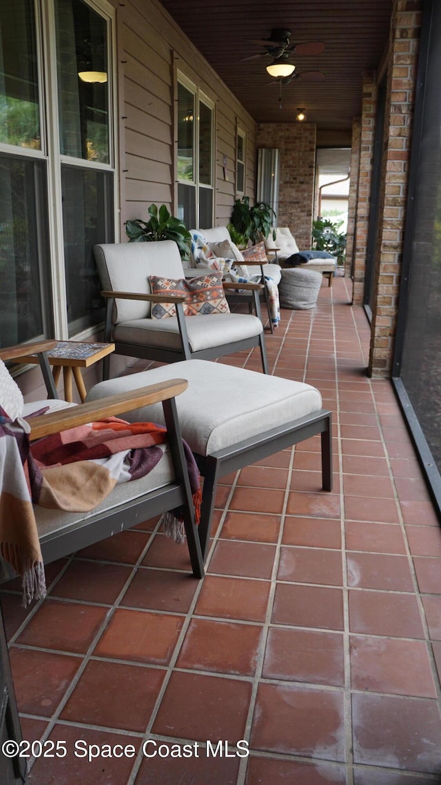 view of patio with ceiling fan and a porch