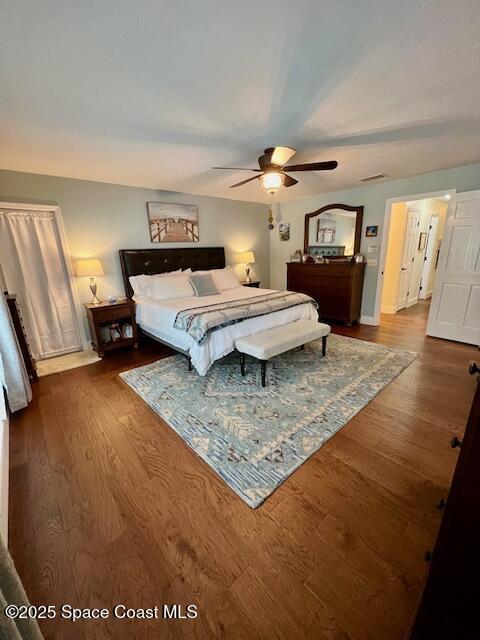 bedroom featuring ceiling fan and hardwood / wood-style flooring