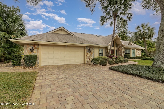 single story home featuring a garage