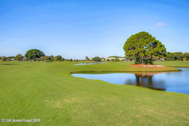 exterior space featuring a water view and a lawn