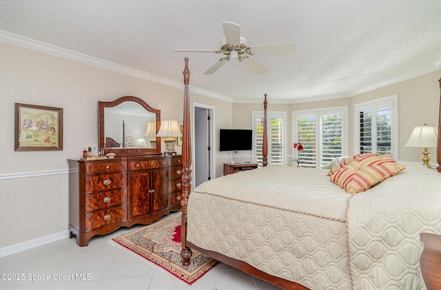 tiled bedroom with ceiling fan and crown molding