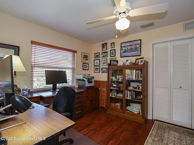 office with dark wood-type flooring and ceiling fan