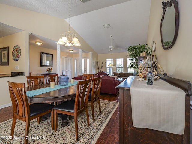 dining room with vaulted ceiling, dark wood-type flooring, and ceiling fan