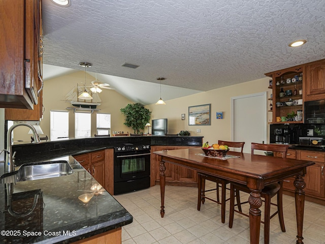 kitchen with sink, hanging light fixtures, a textured ceiling, vaulted ceiling, and oven