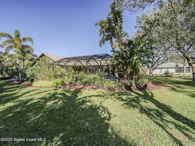 view of yard featuring a lanai