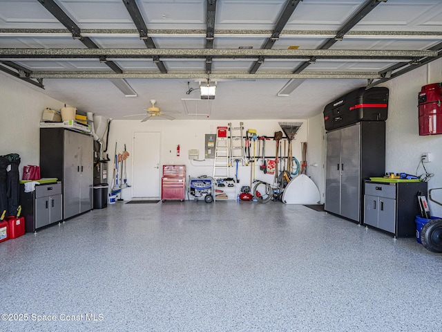 garage featuring a garage door opener and ceiling fan