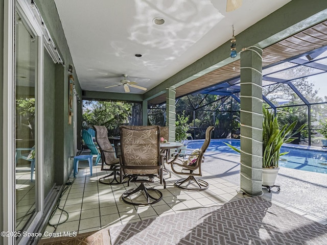 view of patio with a lanai and ceiling fan