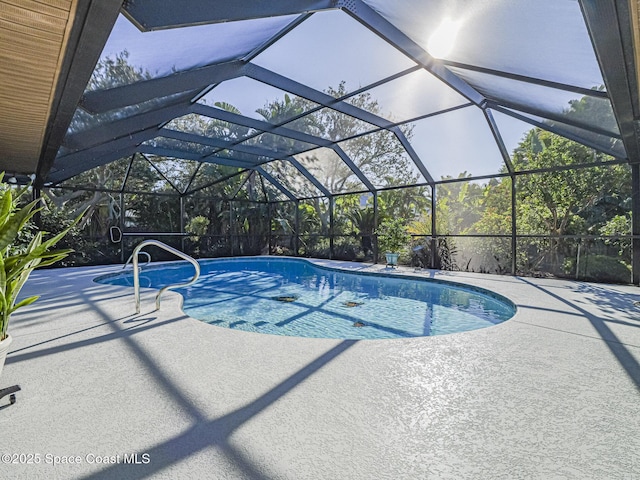 view of pool with a lanai and a patio area